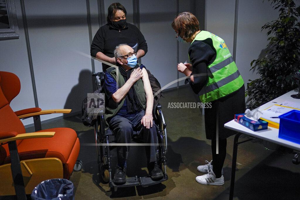 Francisco Seco A man receives his first dose of the AstraZeneca COVID-19 vaccine in a mass vaccination site at the Brabanthal event center in Heverlee, Belgium, Wednesday, March 17, 2021. The European Commission President Ursula von der Leyen criticized Anglo-Swedish vaccine-maker AstraZeneca on Wednesday, accusing the embattled pharmaceutical company of delaying Europe's coronavirus vaccination campaign and warning that the EU is weighing export bans to ensure supplies. (AP Photo/Francisco Seco)