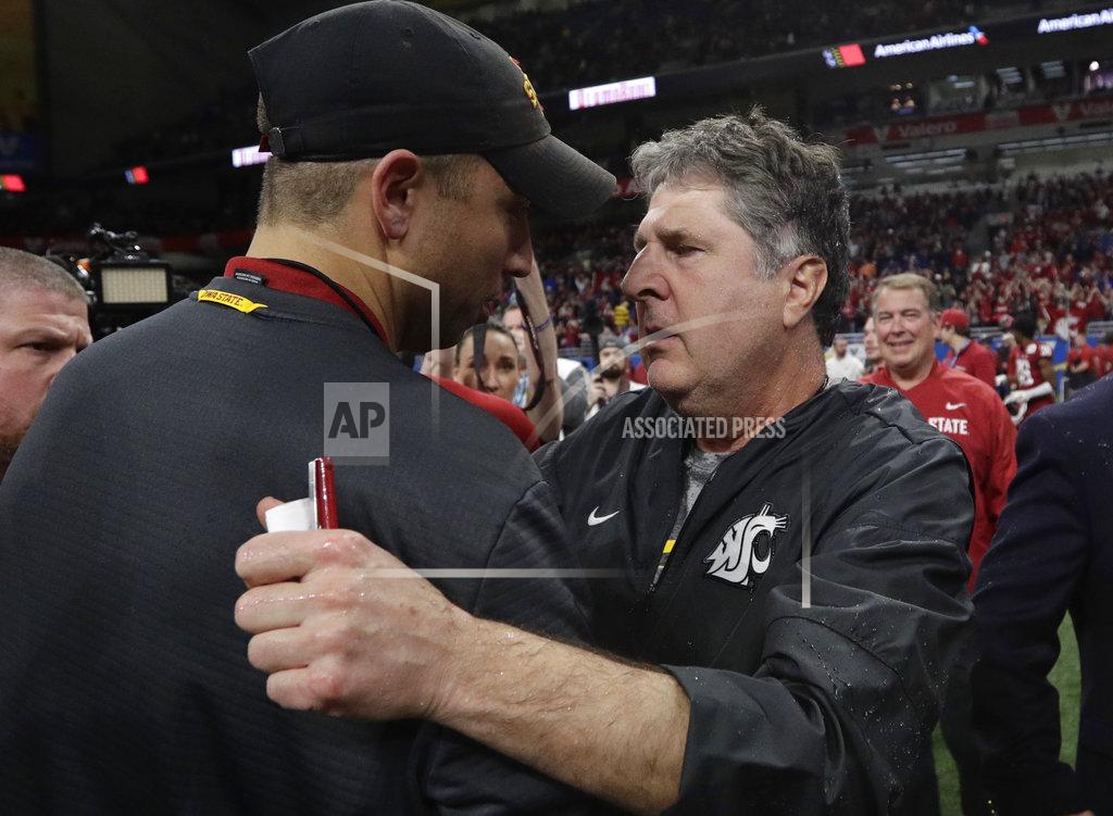 Eric Gay Washington State coach Mike Leach, right, and Iowa State coach Matt Campbell meet at midfield after the Alamo Bowl NCAA college football game, Friday, Dec. 28, 2018, in San Antonio. Washington State won 28-26. (AP Photo/Eric Gay)