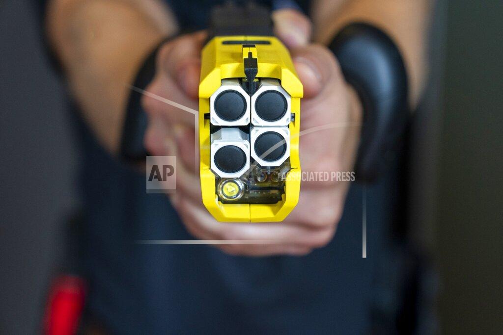 Jacquelyn Martin VR equipment and a version of the TASER 7 that utilizes VR technology for training, is demonstrated, Thursday, May 12, 2022, in Washington. Axon, the company that is best known for developing the Taser, is expanding virtual reality and immersive training in an effort to encourage police officers across the U.S. to more regularly train with less-than-lethal weapons. (AP Photo/Jacquelyn Martin)