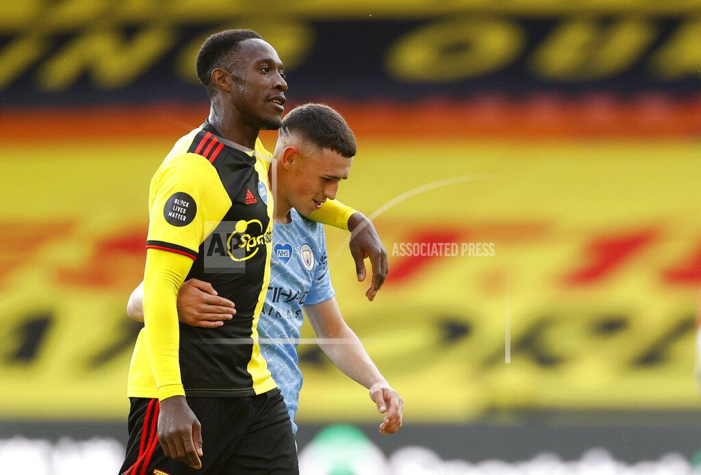 John Sibley Watford's Danny Welbeck, front, and Manchester City's Phil Foden leave the field at the end of the English Premier League soccer match between Watford and Manchester City at the Vicarage Road Stadium in Watford, England, Tuesday, July 21, 2020. (John Sibley/Pool via AP)