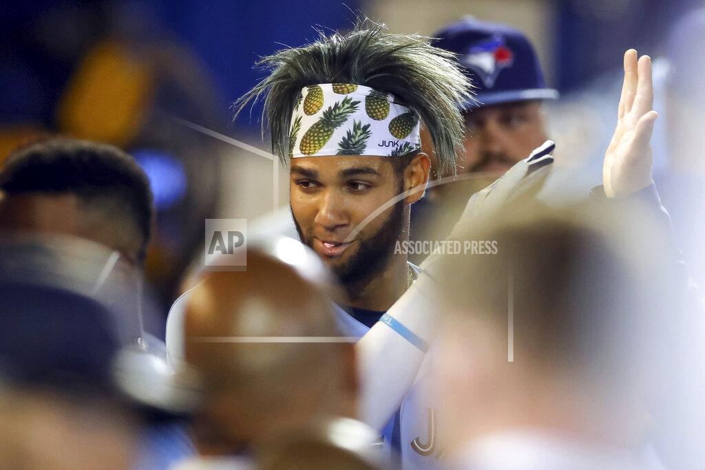 Mike Carlson Toronto Blue Jays' Lourdes Gurriel Jr. celebrates in the dugout after scoring against the Boston Red Sox during the fourth inning of a baseball game Tuesday, May 18, 2021, in Dunedin, Fla. (AP Photo/Mike Carlson)