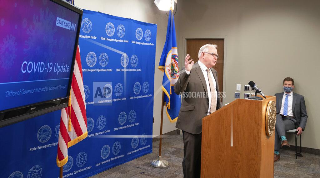 Glen Stubbe Minnesota Gov. Tim Walz announces new guidelines today for restaurants, bars, salons and barber shops during the coronavirus pandemic Wednesday, May 20, 2020. Restaurants and bars may reopen June 1 for outdoor dining with social distancing and other safeguards in place, while salons and barbershops will also be allowed to resume business at partial capacity. (Glen Stubbe/Star Tribune via AP, Pool)