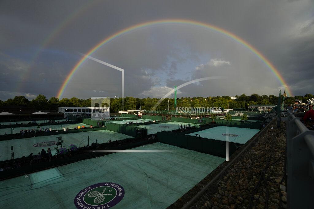 Alastair Grant A rainbow arches in the sky as seen from the courts on day four of the Wimbledon tennis championships in London, Thursday, June 30, 2022. (AP Photo/Alastair Grant)