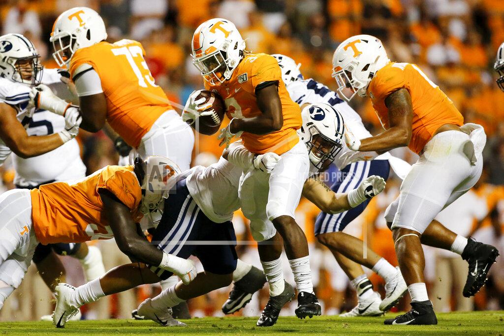 C.b. Schmelter Tennessee running back Eric Gray (3) breaks a tackle attempt from BYU linebacker Jackson Kaufusi (38) during an NCAA football game at Neyland Stadium on Saturday, Sept. 7, 2019 in Knoxville, Tenn.(C.B. Schmelter/Chattanooga Times Free Press via AP)