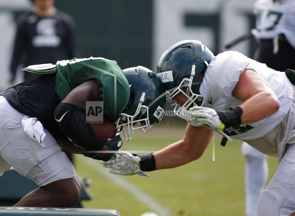Al Goldis Michigan State running back Alante Thomas, left, and linebacker Ed Warinner collide as they run a drill during an NCAA college football practice, Monday, Aug. 12, 2019, in East Lansing, Mich. (AP Photo/Al Goldis)