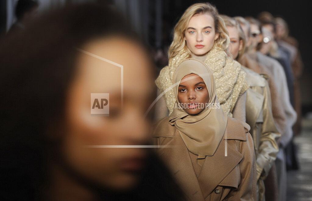 FILE - In this Feb. 23, 2017 file photo, Somali-American model Halima Aden wears a creation part of the Max Mara women's Fall-Winter 2017-18 collection, that was presented in Milan, Italy. Somali-American model Halima Aden has announced that she is taking a step back from the fashion industry, saying that the pandemic slowdown has given her time to see instances when her desire to maintain a hijab was not properly respected. (AP Photo/Luca Bruno).