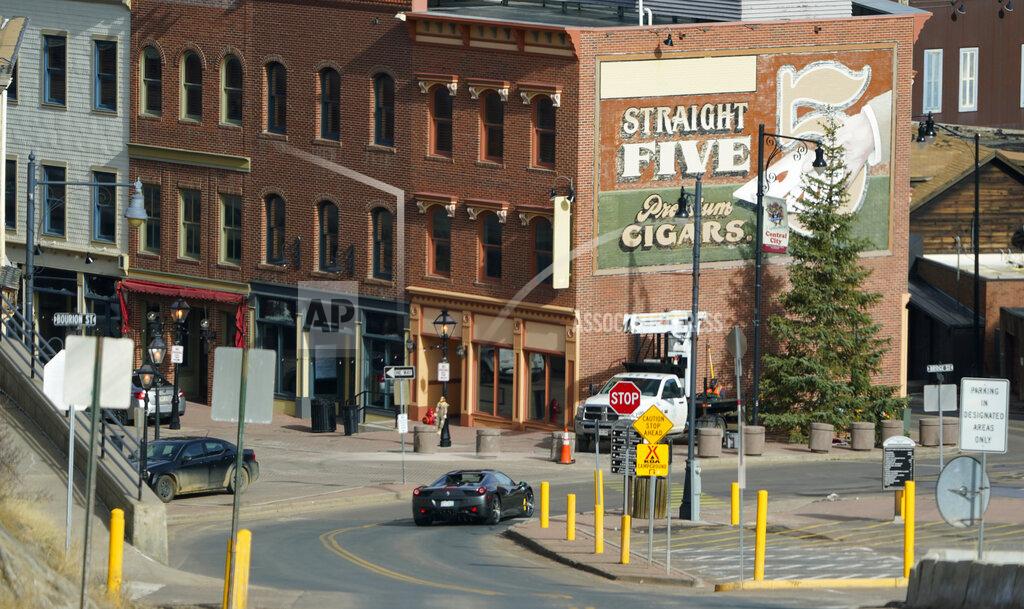 David Zalubowski A Ferrari makes a quick stop at a sign on Main Street in the gaming town of Central City, Colo., Wednesday, Nov. 18, 2020. (AP Photo/David Zalubowski)