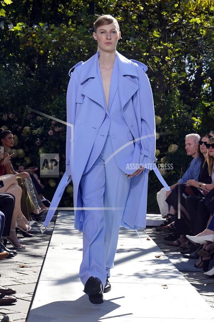 Richard Drew The Michael Kors Spring/Summer 2022 collection is modeled during Fashion Week, in New York, Friday, Sept. 10, 2021. (AP Photo/Richard Drew)