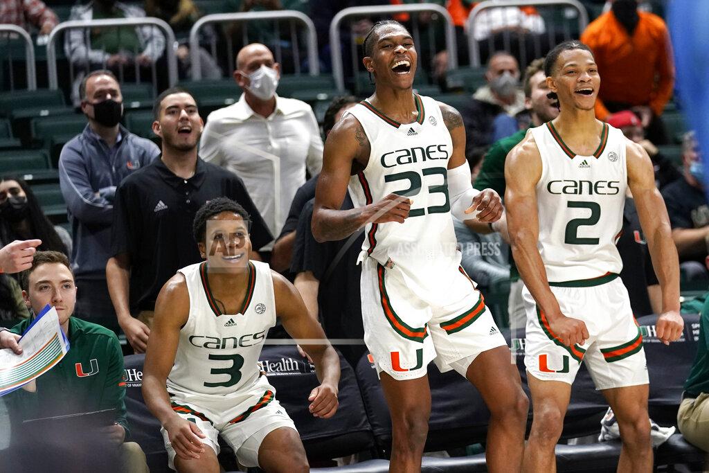 Lynne Sladky Miami guard Charlie Moore (3), guard Kameron McGusty (23) and guard Isaiah Wong (2) react on the sideline during the second half of an NCAA college basketball game against North Carolina, Tuesday, Jan. 18, 2022, in Coral Gables, Fla. Miami won 85-57. (AP Photo/Lynne Sladky)