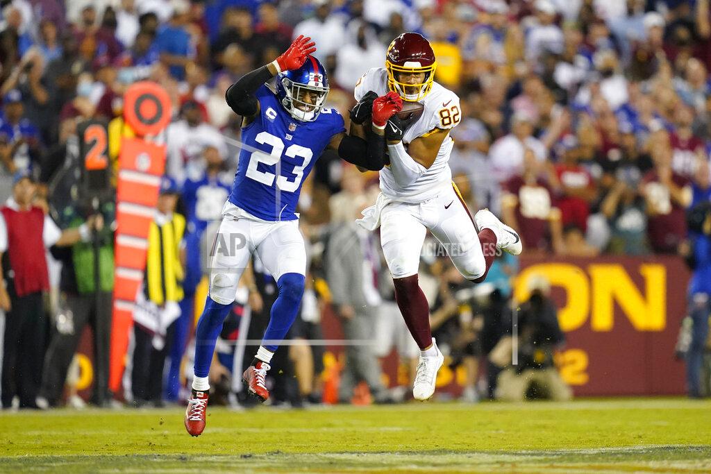 Patrick Semansky Washington Football Team tight end Logan Thomas (82) makes a catch for a first down against New York Giants cornerback Logan Ryan (23) during the first half of an NFL football game, Thursday, Sept. 16, 2021, in Landover, Md. (AP Photo/Patrick Semansky)