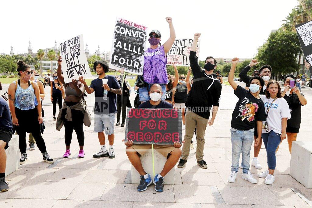 Douglas R. Clifford A group of peaceful protesters gather at Curtis Hixon Park to demand justice for victims of police brutality, Sunday, May 31, 2020, in downtown Tampa, Fla. (Douglas R. Clifford/Tampa Bay Times via AP)