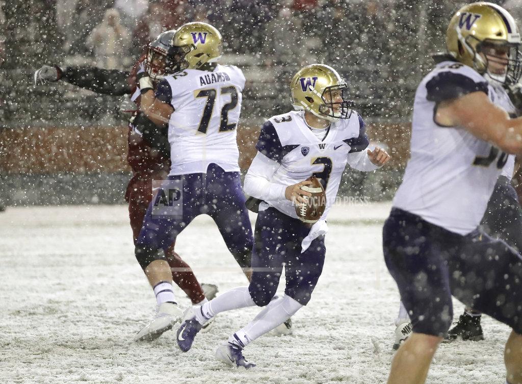 Ted S. Warren Washington quarterback Jake Browning (3) scrambles in the pocket during the second half of an NCAA college football game against Washington State, Friday, Nov. 23, 2018, in Pullman, Wash. (AP Photo/Ted S. Warren)