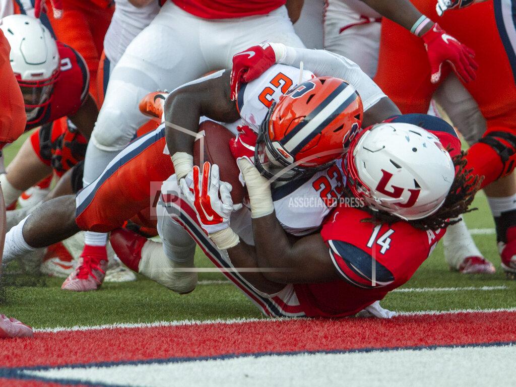 Matt Bell Syracuse running back Abdul Adams scores a touchdown as Liberty linebacker Solomon Ajayi defends during the first half of NCAA college football game in Lynchburg, Va. Saturday, Aug. 31, 2019. (AP Photo/Matt Bell)