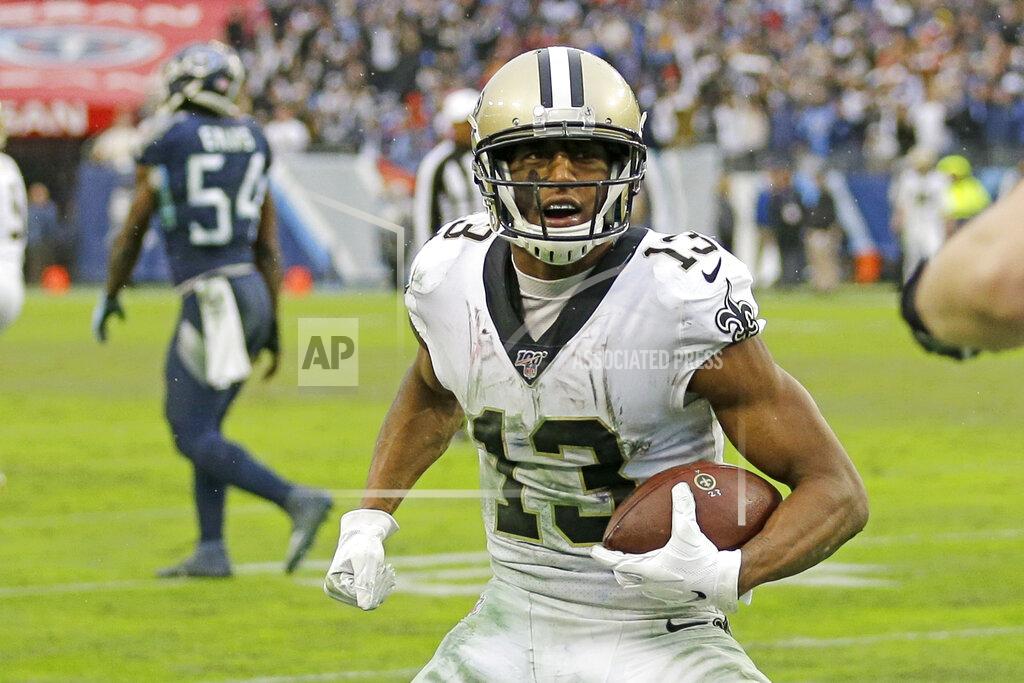 James Kenney FILE - In this Dec. 22, 2019, file photo, New Orleans Saints wide receiver Michael Thomas (13) scores a touchdown on a 2-yard pass reception against the Tennessee Titans during the second half of an NFL football game in Nashville, Tenn. Saints receivers Emmanuel Sanders and Thomas are on the cusp of returning to New Orleans’ passing game at an opportune time. Both are practicing as the Saints prepare for a visit to Tampa Bay on Sunday night. (AP Photo/James Kenney, File)