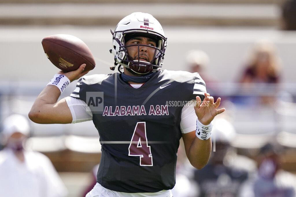 Rogelio V. Solis Alabama A&M quarterback Aqeel Glass (4) passes against Arkansas-Pine Bluff during the first half of the Southwestern Athletic Conference NCAA college football game, Saturday, May 1, 2021, in Jackson, Miss. (AP Photo/Rogelio V. Solis)