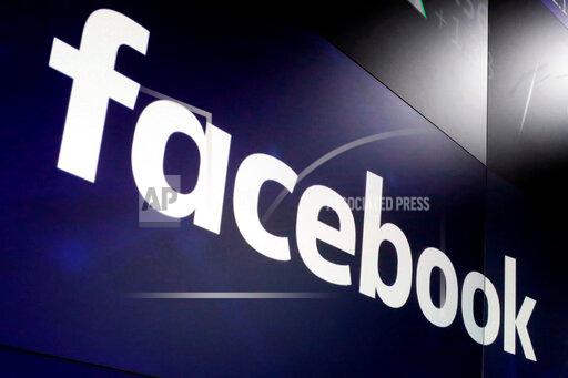 FILE - In this March 29, 2018 file photo, the logo for Facebook appears on screens at the Nasdaq MarketSite in New York's Times Square. Britain's competition watchdog fined Facebook 50.5 million pounds ($69.4 million) on Wednesday Oct. 20, 2021, for violating rules during the U.K. investigation into the social media giant’s purchase of Giphy. (AP Photo/Richard Drew, File)