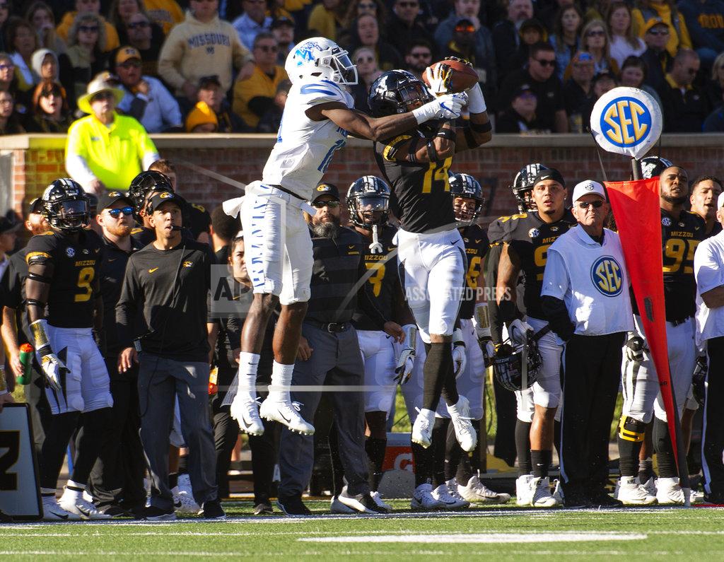 L.g. Patterson Missouri defensive back Adam Sparks, right, intercepts a pass in front of Memphis wide receiver Damonte Coxie, left, during the first half of an NCAA college football game Saturday, Oct. 20, 2018, in Columbia, Mo. (AP Photo/L.G. Patterson)