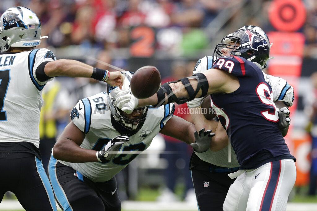Michael Wyke Houston Texans defensive end J.J. Watt (99) knocks the ball away from Carolina Panthers quarterback Kyle Allen (7) during the second half of an NFL football game Sunday, Sept. 29, 2019, in Houston. Watt recovered the fumble. (AP Photo/Michael Wyke)