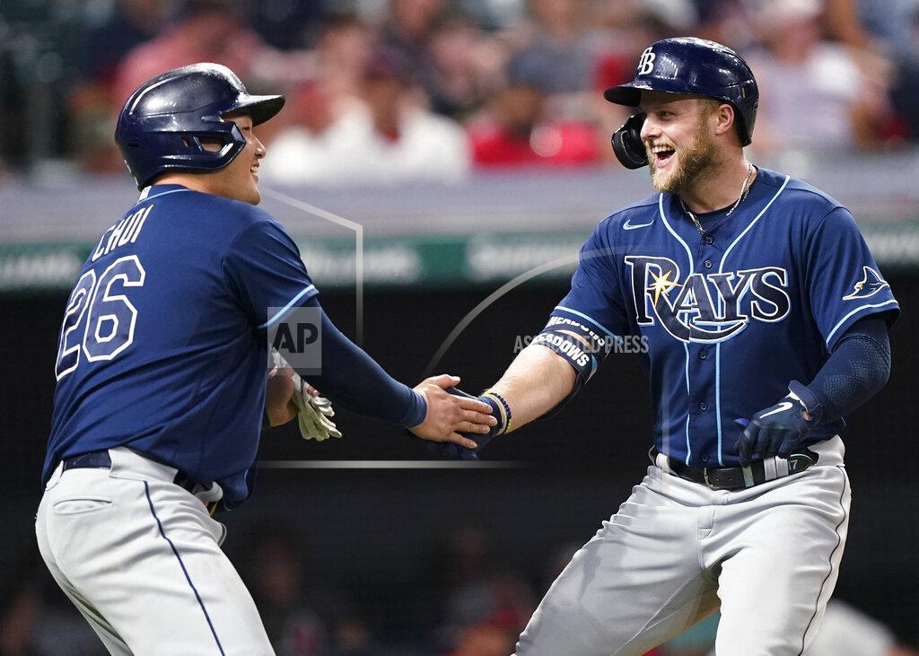Tony Dejak Tampa Bay Rays' Austin Meadows, right, is congratulated by Ji-Man Choi after Meadows hit a two-run home run in the ninth inning of the team's baseball game against the Cleveland Indians, Saturday, July 24, 2021, in Cleveland. (AP Photo/Tony Dejak)