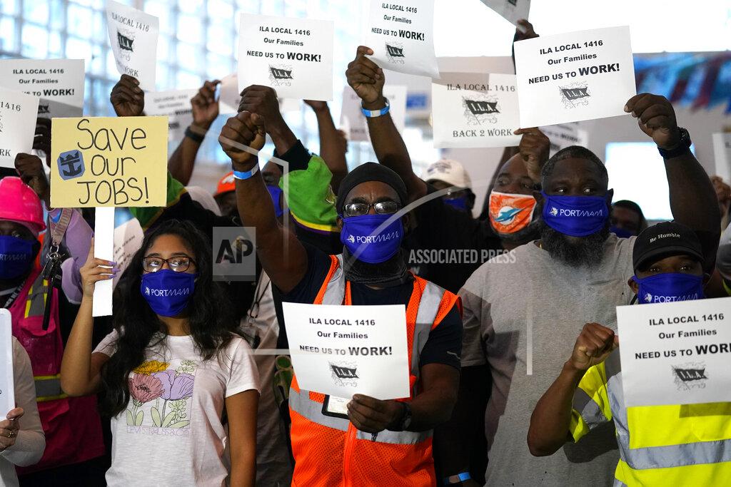 Lynne Sladky FILE - In this Oct. 21, 2020, file photo, Lernathan Rowe, center, chants during a protest at PortMiami by workers in the cruise ship industry wanting to return to work, in Miami. The Centers for Disease Control and Prevention (CDC) issued a No Sail Order for cruise ships in waters subject to U.S. jurisdiction through the new year. (AP Photo/Lynne Sladky, File)