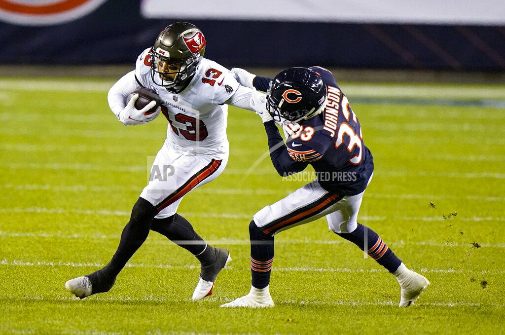 Nam Y. Huh Tampa Bay Buccaneers wide receiver Mike Evans (13) is tackled by Chicago Bears cornerback Jaylon Johnson (33) during the second half of an NFL football game in Chicago, Thursday, Oct. 8, 2020. (AP Photo/Nam Y. Huh)