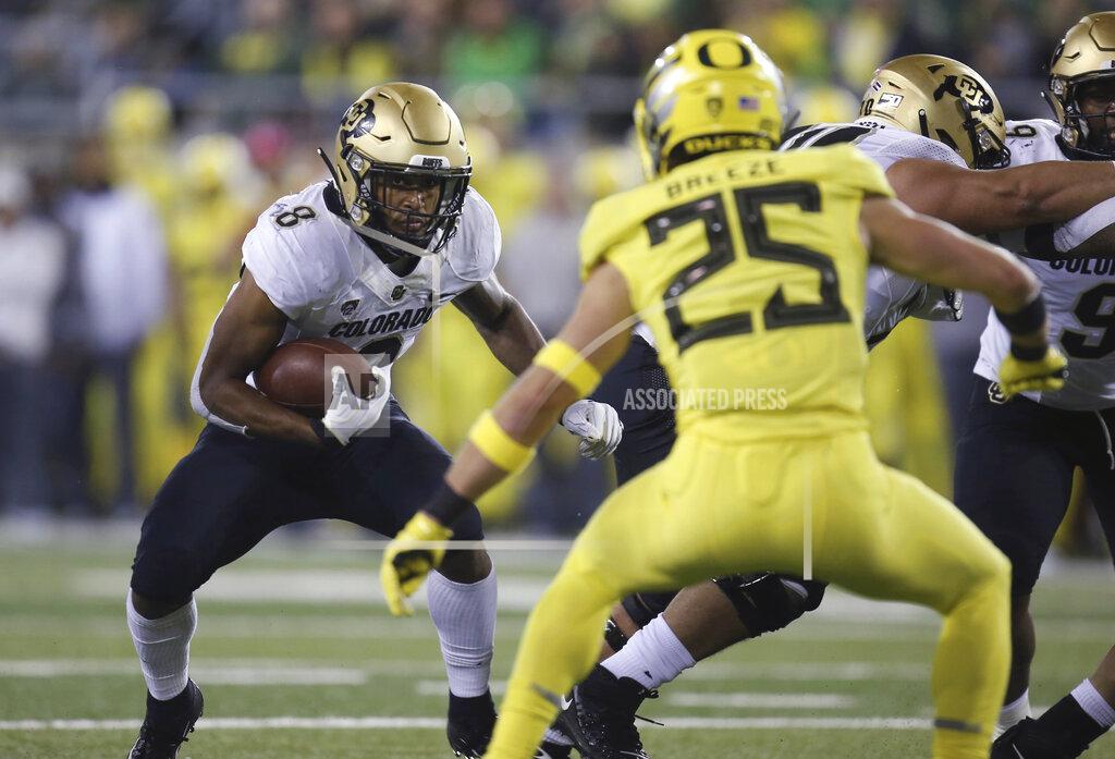 Chris Pietsch Colorado's Alex Fontenot, left, rushes as Oregon's Brady Breeze defends during the second quarter of an NCAA college football game Friday, Oct. 11, 2019, in Eugene, Ore. (AP Photo/Chris Pietsch)