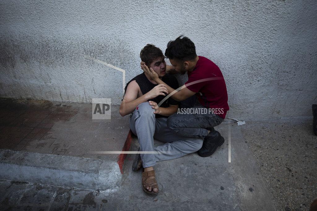 Fatima Shbair Relatives react while waiting at the hospital to see the body of Islamic Jihad said Taiseer al-Jabari who was killed during Israeli airstrikes on his apartment in Gaza City, Friday, Aug. 5, 2022. Palestinian officials say Israeli airstrikes on Gaza have killed several people, including a senior militant, and wounded 40 others. (AP Photo/Fatima Shbair)