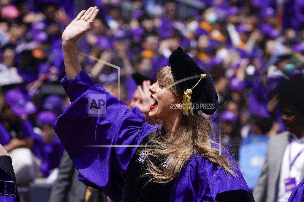 Seth Wenig Taylor Swift, center, waves to graduates as she participates in a graduation ceremony for New York University at Yankee Stadium in New York, Wednesday, May 18, 2022. (AP Photo/Seth Wenig)