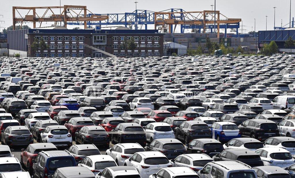 Martin Meissner New cars are stored at the 'logport' (logistic port) in Duisburg, Germany, Wednesday, June 3, 2020. The car industry is expecting help by the German government because ot the economy crisis due to the coronavirus pandemic. (AP Photo/Martin Meissner)