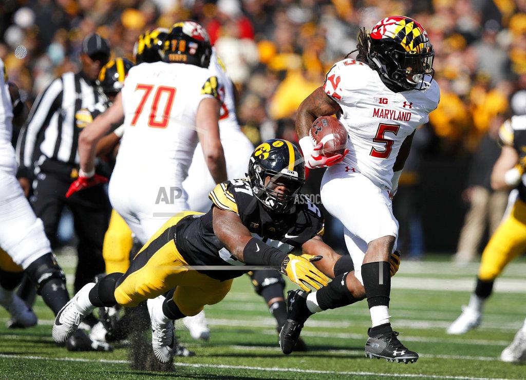 Charlie Neibergall Maryland running back Anthony McFarland (5) is tackled by Iowa defensive end Chauncey Golston (57) during the second half of an NCAA college football game, Saturday, Oct. 20, 2018, in Iowa City, Iowa. Iowa won 23-0. (AP Photo/Charlie Neibergall)