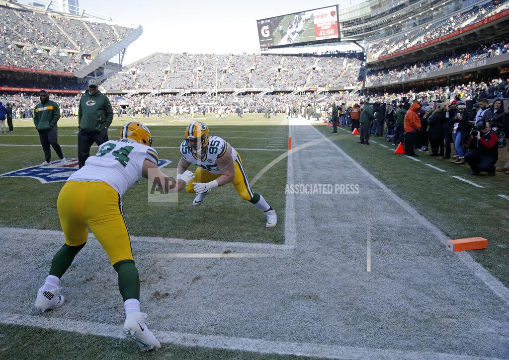 David Banks In this Dec. 16, 2018 photo, Green Bay Packers defensive end Dean Lowry (94) and defensive tackle Tyler Lancaster (95) warm up as fans watch from the sideline before an NFL football game against the Chicago Bears in Chicago. The Bears have ended a pregame perk that prompted a lawsuit by a lifelong Green Bay Packers fan who wanted to wear the Wisconsin team's green and gold apparel to warmups at Soldier Field. Bears attorney Paul Greenwalt tells The Chicago Tribune that the team is eliminating the program that allows season ticket holders to attend pregame warmups in a marketing reorganization. (AP Photo/David Banks)