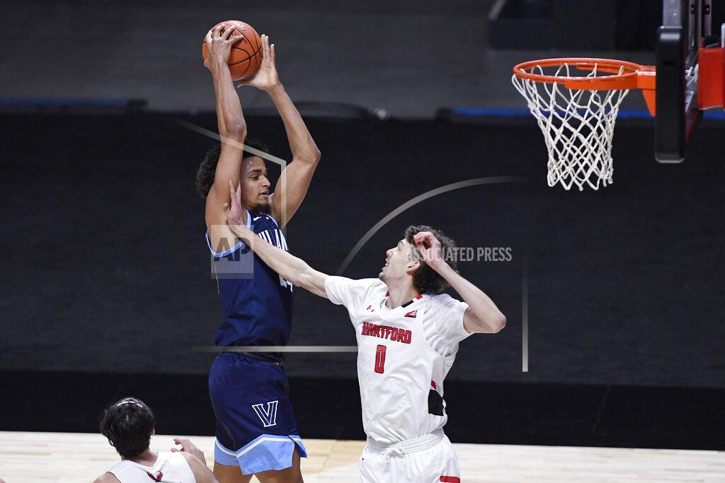 Jessica Hill Villanova's Jeremiah Robinson-Earl, left, grabs an offensive rebound over Hartford's Hunter Marks during the first half of an NCAA college basketball game Tuesday, Dec. 1, 2020, in Uncasville, Conn. (AP Photo/Jessica Hill)