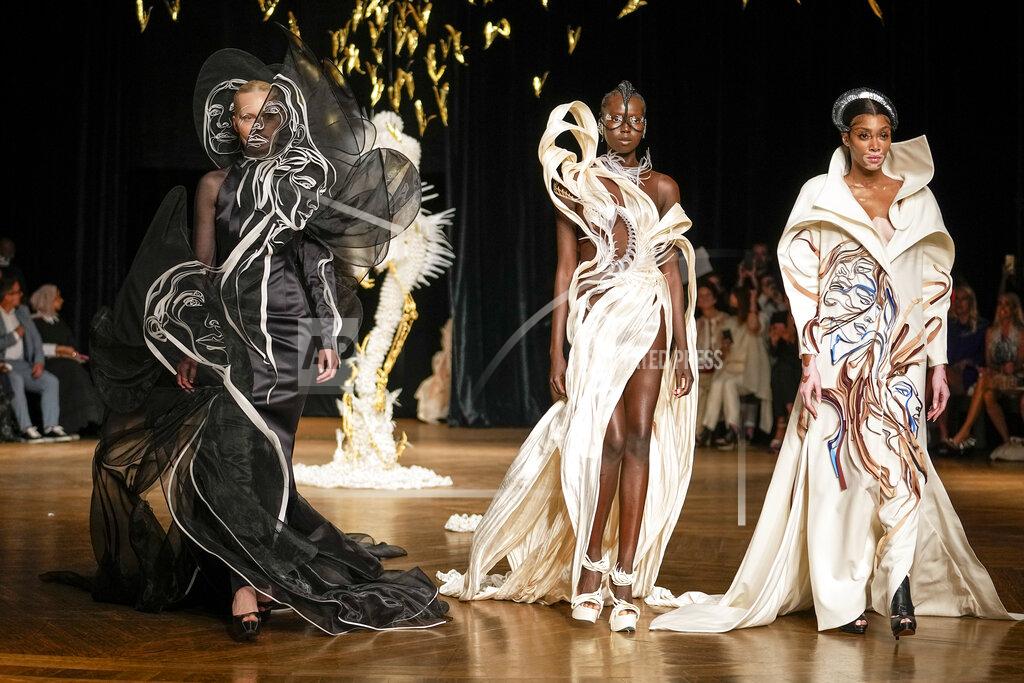 Michel Euler Winnie Harlow, from right, and models wear creations as part of Iris van Herpen Haute Couture Fall/Winter 2022-2023 fashion collection presented Monday, July 4, 2022 in Paris. (AP Photo/Michel Euler)
