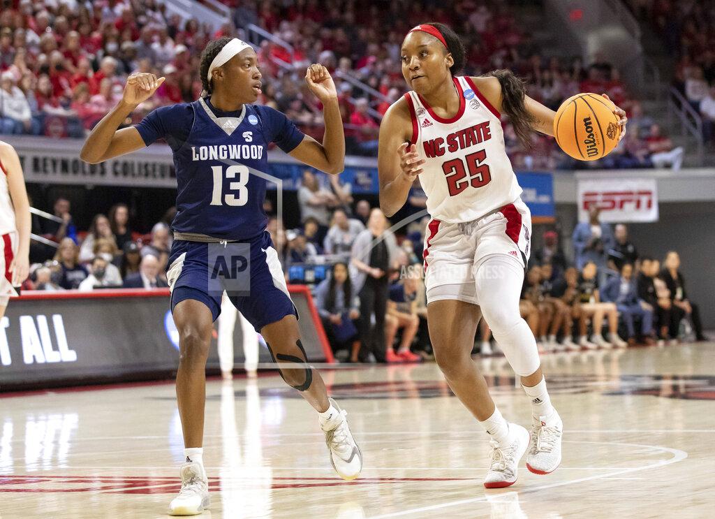 Ben Mckeown North Carolina State's Kayla Jones (25) drives against Longwood's Akila Smith (13) during the second half of a college basketball game in the first round of the NCAA tournament in Raleigh, N.C., Saturday, March 19, 2022. (AP Photo/Ben McKeown)