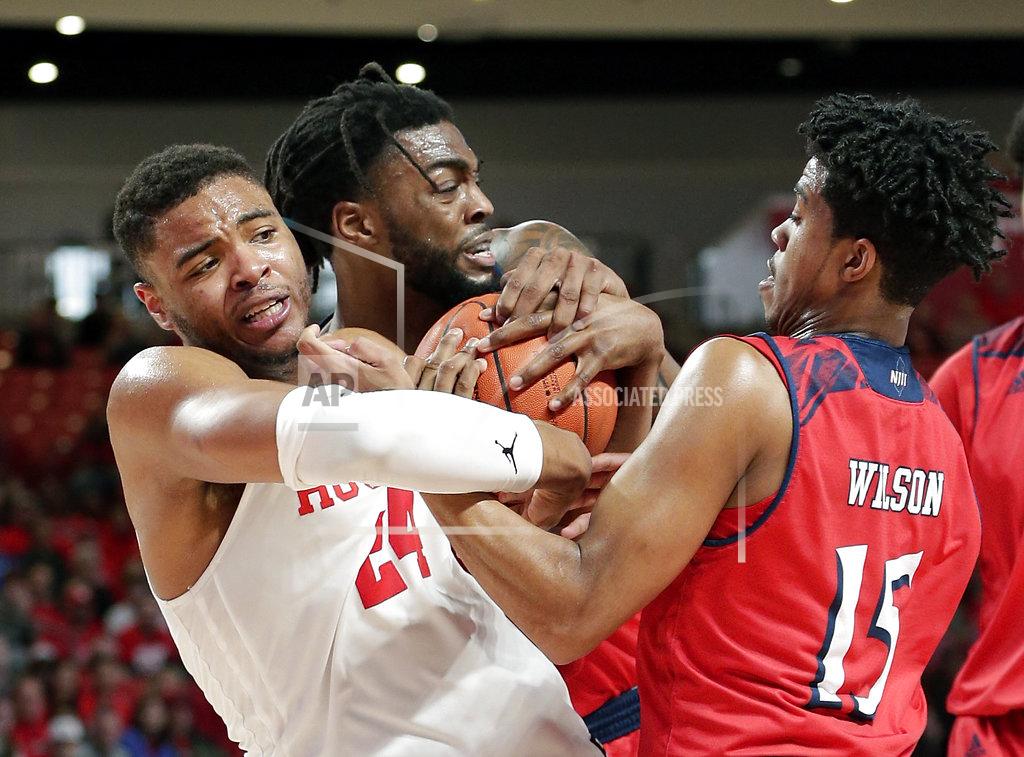 Michael Wyke Houston forward Breaon Brady (24) grapples for control of the ball with New Jersey Institute of Technology forward Abdul Lewis, middle, and guard Diandre Wilson (15) during the first half of an NCAA college basketball game Saturday, Dec. 29, 2018, in Houston. The play resulted in a double technical foul on both teams. (AP Photo/Michael Wyke)