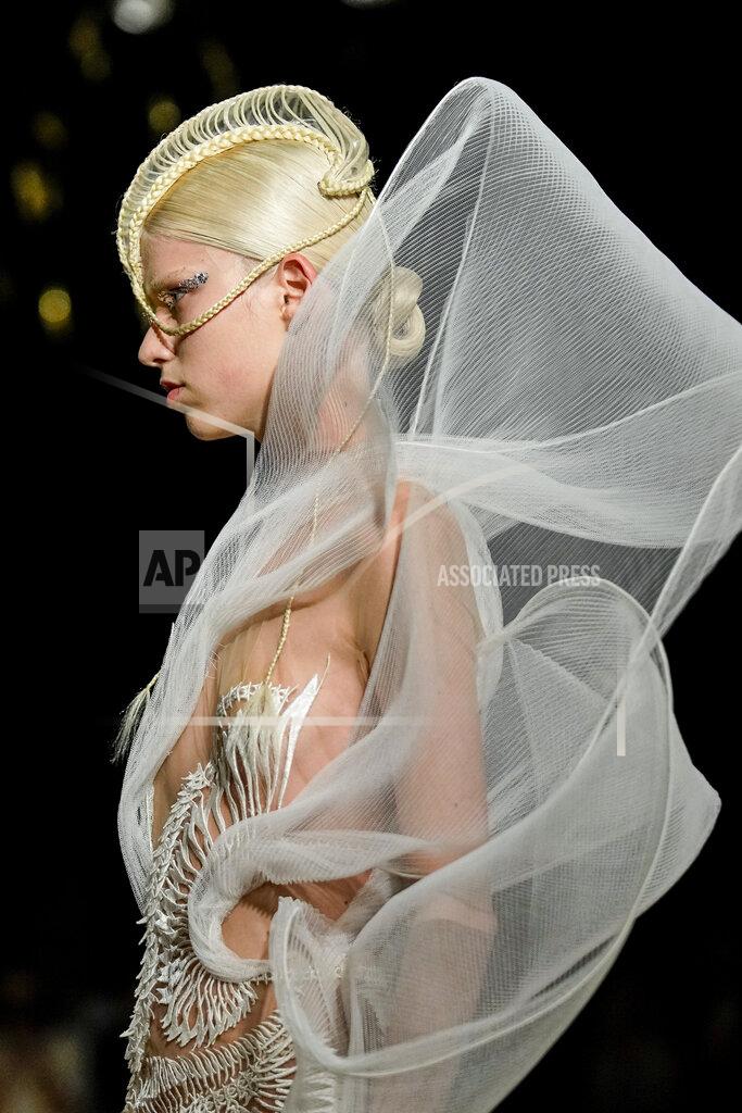 Michel Euler A model wears a creation as part of Iris van Herpen Haute Couture Fall/Winter 2022-2023 fashion collection presented Monday, July 4, 2022 in Paris. (AP Photo/Michel Euler)