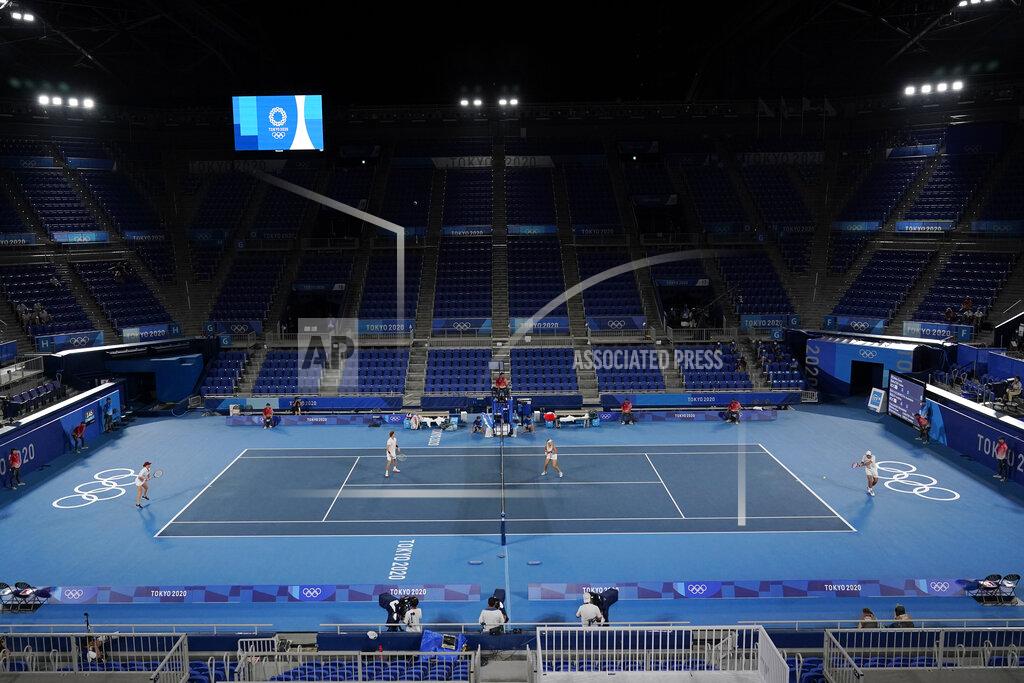 Elena Vesnina and Aslan Karatsev, of the Russian Olympic Committee, play Anastasia Pavlyuchenkova and Andrey Rublev, of the Russian Olympic Committee, during the mixed doubles gold medal match of the tennis competition at the 2020 Summer Olympics, Sunday, Aug. 1, 2021, in Tokyo, Japan. (AP Photo/Seth Wenig)