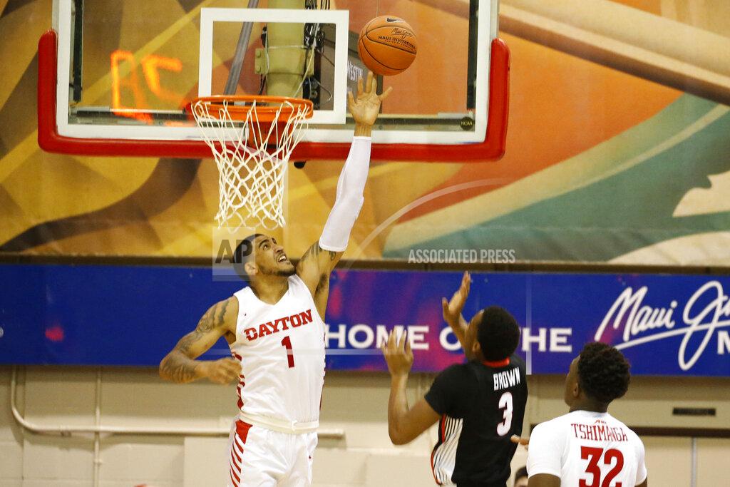 Marco Garcia Dayton forward Obi Toppin (1) tips away a shot from Georgia forward Christian Brown (3) during the first half of an NCAA college basketball game Monday, Nov. 25, 2019, in Lahaina, Hawaii. (AP Photo/Marco Garcia)