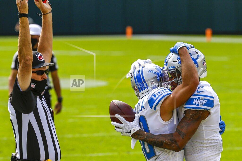 Mike Roemer Detroit Lions' Marvin Jones celebrates his touchdown catch with teammate Danny Amendola during the first half of an NFL football game against the Green Bay Packers Sunday, Sept. 20, 2020, in Green Bay, Wis. (AP Photo/Mike Roemer)