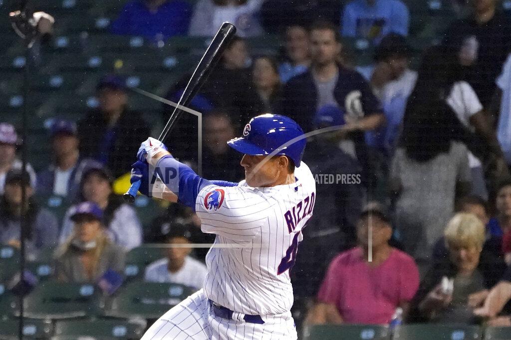Charles Rex Arbogast Chicago Cubs' Anthony Rizzo follows through on an RBI triple off Philadelphia Phillies starting pitcher Zack Wheeler during the second inning of a baseball game Wednesday, July 7, 2021, in Chicago. Joc Pederson scored. (AP Photo/Charles Rex Arbogast)