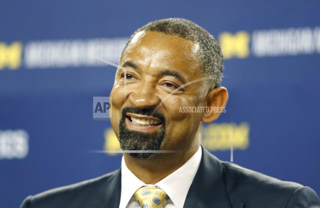 Carlos Osorio Juwan Howard smiles during his introduction as Michigan's new men's basketball coach, Thursday, May 30, 2019 in Ann Arbor, Mich. The former member of the Fab Five has a five-year contract that will pay him $2 million in his first year. The former Miami Heat assistant coach replaces John Beilein, who left to coach the Cleveland Cavaliers. (AP Photo/Carlos Osorio)