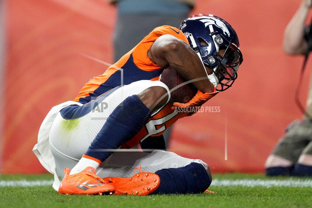 Denver Broncos wide receiver Courtland Sutton scores a touchdown against the Los Angeles Rams during the first half of an NFL preseason football game, Saturday, Aug. 28, 2021, in Denver. (AP Photo/David Zalubowski)