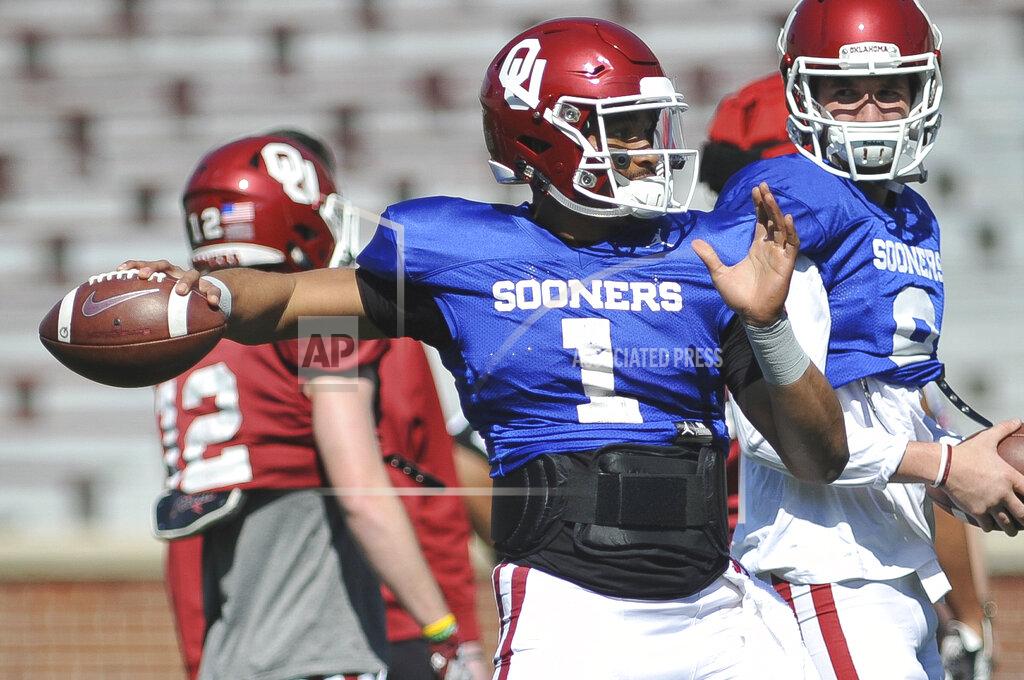 Oklahoma quarterback Jalen Hurst throws during practice in norman, Okla., Monday, April 1, 2019. Jalen Hurts is now at Oklahoma and apparently he is bringing a bit of Nick Saban’s process to the Sooners. On the latest AP Top 25 College Football Podcast, George Schroeder of USA Today joins AP’s Ralph Russo to talk about the transition from Alabama to Oklahoma for Hurts. (Kyle Phillips/The Norman Transcript via AP)