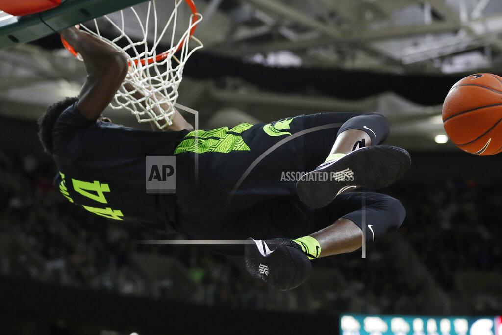 Carlos Osorio Michigan State forward Gabe Brown hangs from the rim after a dunk during the second half of an NCAA college basketball game against Wisconsin, Friday, Jan. 17, 2020, in East Lansing, Mich. (AP Photo/Carlos Osorio)