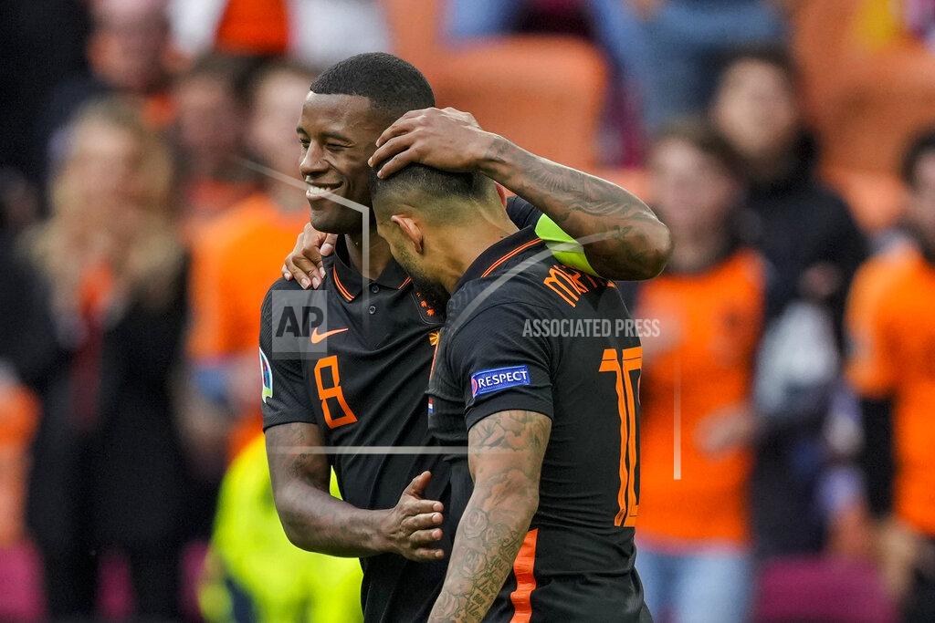 Peter Dejong Georginio Wijnaldum of the Netherlands, left, and Memphis Depay of the Netherlands celebrate after scoring their team second goal during the Euro 2020 soccer championship group C match between The Netherlands and North Macedonia at the Johan Cruyff ArenA in Amsterdam, Netherlands, Monday, June 21, 2021. (AP Photo/Peter Dejong, Pool)