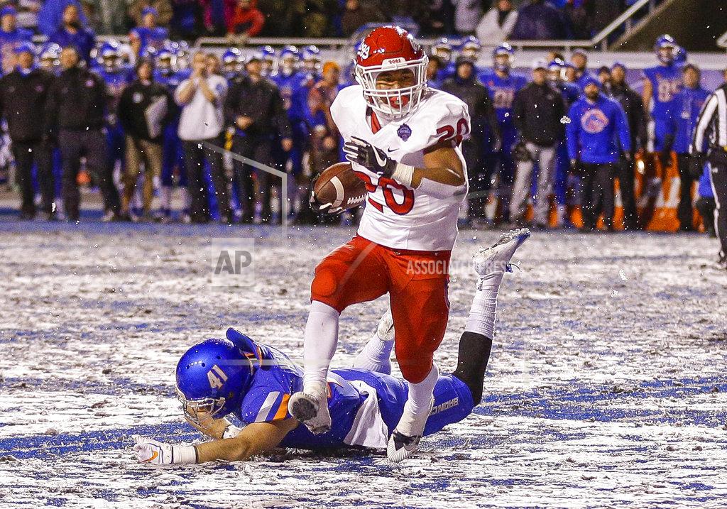 Steve Conner Fresno State running back Ronnie Rivers (20) runs past the diving tackle attempt by Boise State linebacker Will Heffner (41) for a touchdown in overtime in an NCAA college football game for the Mountain West championship, Saturday, Dec. 1, 2018, in Boise, Idaho. Fresno State won 19-16. (AP Photo/Steve Conner)