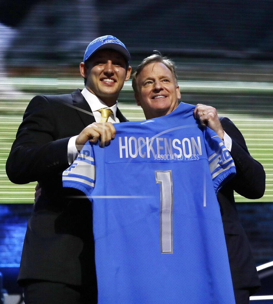 Mark Humphrey Iowa tight end T.J. Hockenson poses with NFL Commissioner Roger Goodell after the Detroit Lions selected Hockenson in the first round at the NFL football draft, Thursday, April 25, 2019, in Nashville, Tenn. (AP Photo/Mark Humphrey)