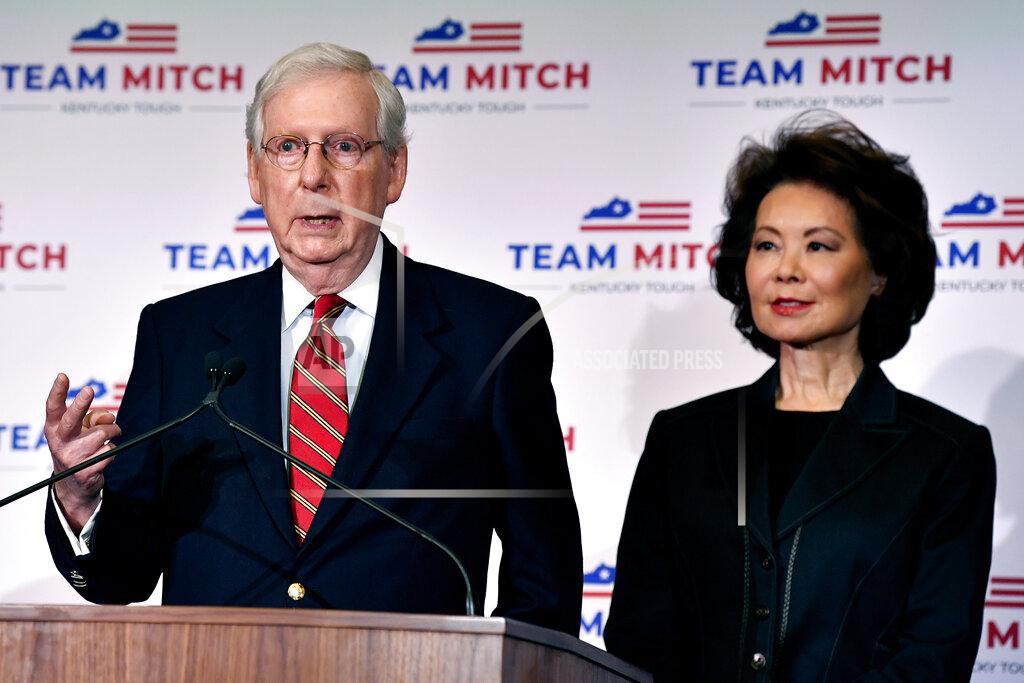 Timothy D. Easley Senate Majority Leader Mitch McConnell, R-Ky., left, and his wife, Transportation Secretary Elaine Chao respond to a reporter's question during a press conference in Louisville, Ky., Wednesday, Nov. 4, 2020. McConnell secured a seventh term in Kentucky, fending off Democrat Amy McGrath. (AP Photo/Timothy D. Easley)