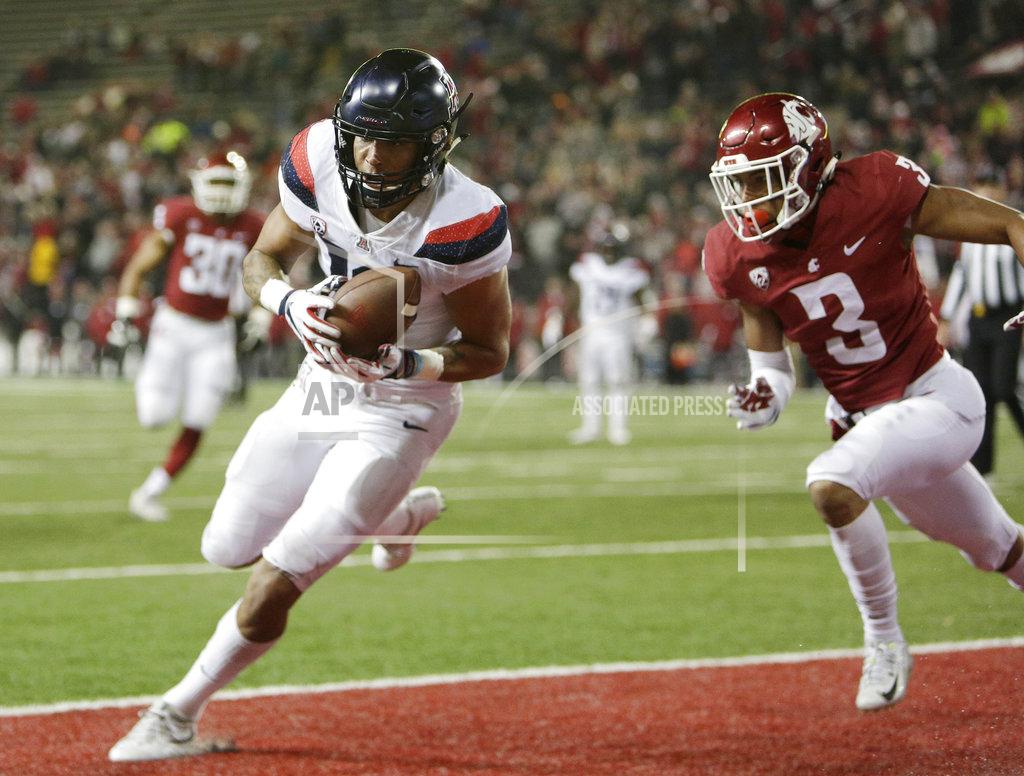 Young Kwak Arizona wide receiver Shawn Poindexter, left, catches a pass for a touchdown in front of Washington State cornerback Darrien Molton (3) during the second half of an NCAA college football game in Pullman, Wash., Saturday, Nov. 17, 2018. Washington State won 69-28. (AP Photo/Young Kwak)