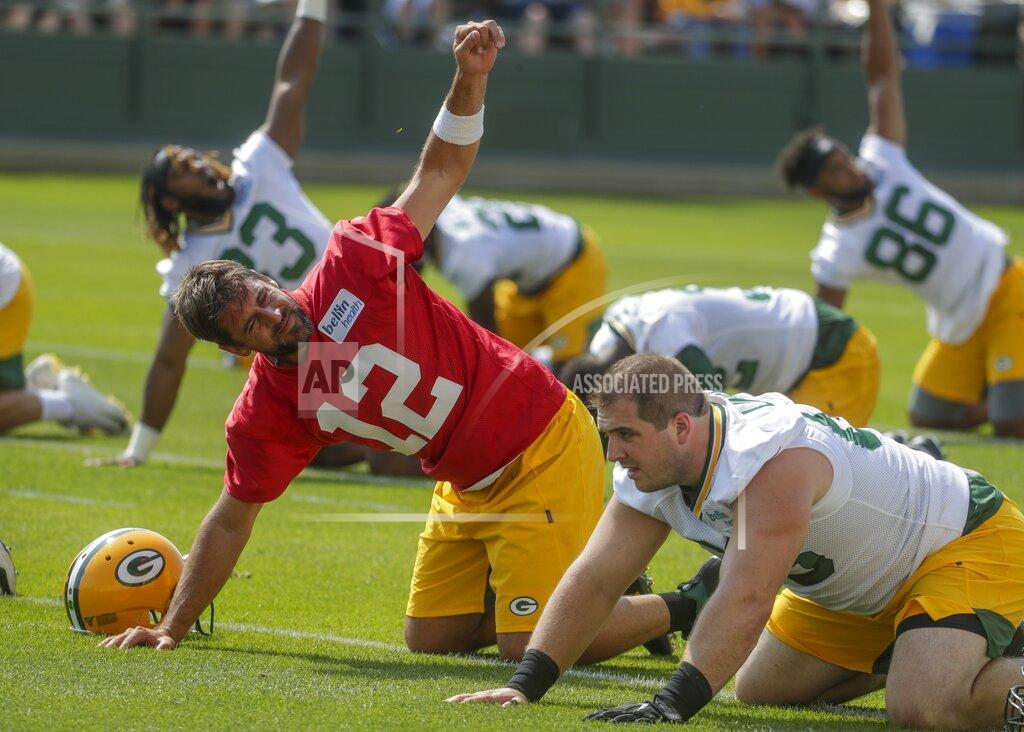 Morry Gash Green Bay Packers' Aaron Rodgers stretches during NFL football training camp Thursday, July 25, 2019, in Green Bay, Wis. (AP Photo/Morry Gash)
